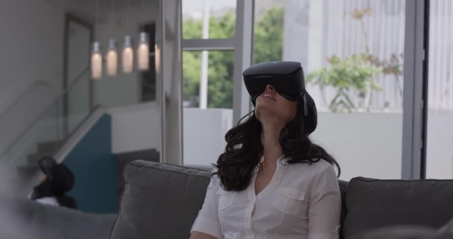 Woman In Apartment Using Electronics