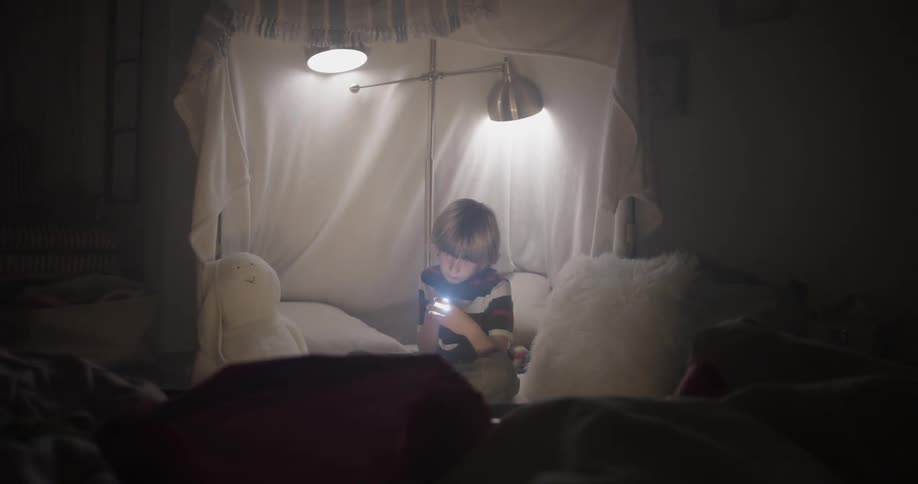 Boy In Blanket Fort