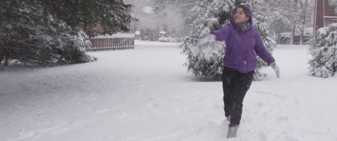 A person playing in the snow