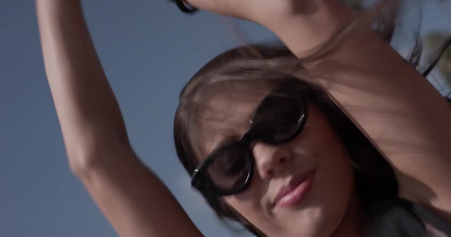 A woman's hair blowing wildly through the wind