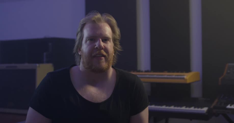 Man in studio looks at camera