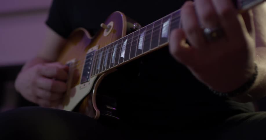 A man playing a guitar