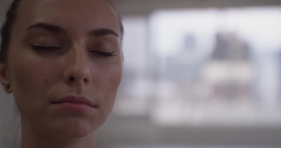 Woman doing yoga sitting on the ground