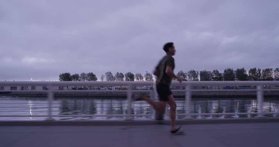 A man running down a sidewalk