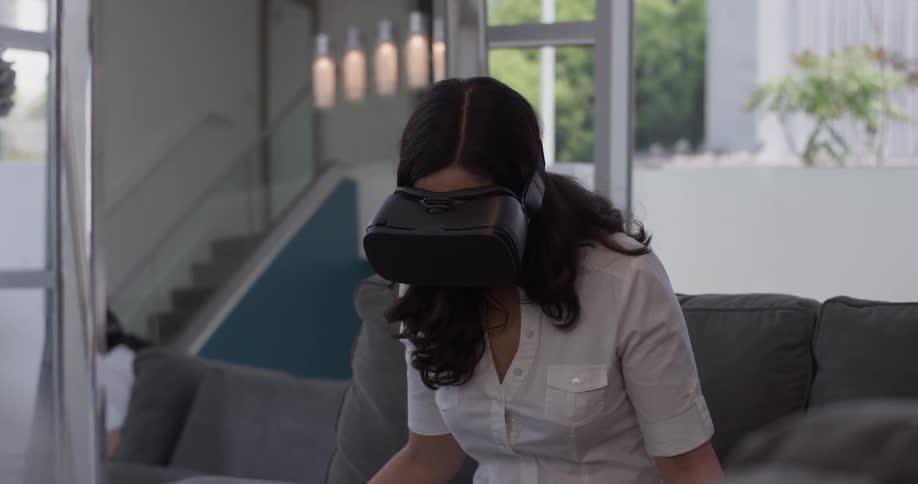 Woman In Apartment Using Electronics