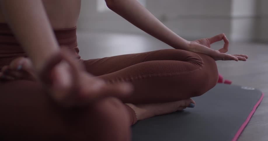 Woman meditates in an empty room