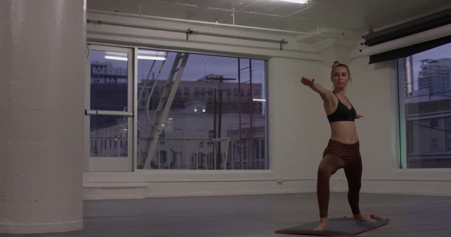 Woman doing yoga in a studio