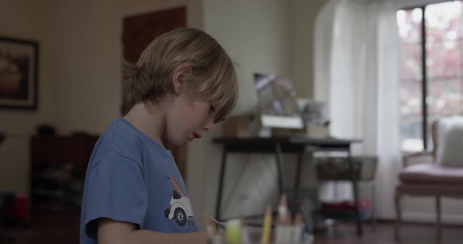 Two children are indoors during midday