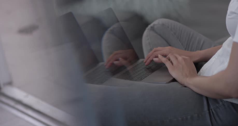 Woman In Apartment Using Electronics