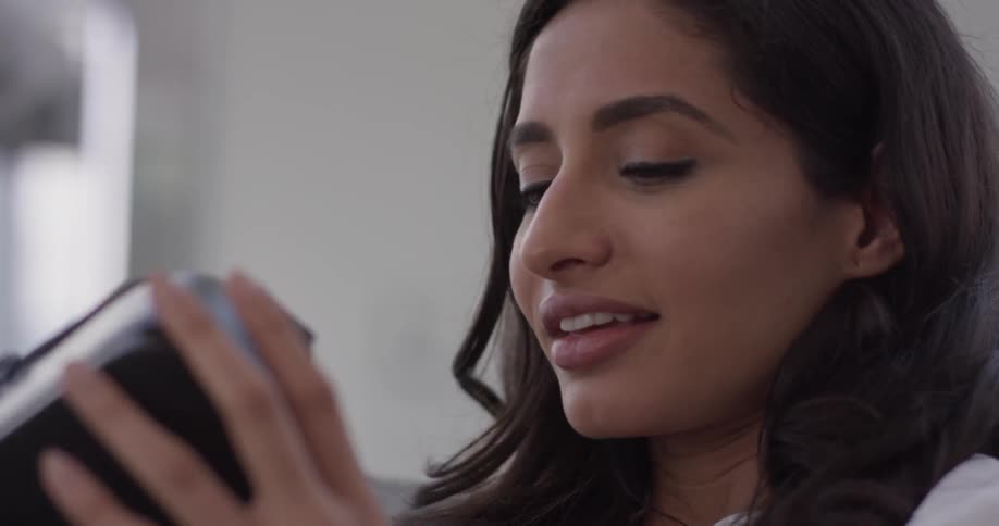 Woman In Apartment Using Electronics