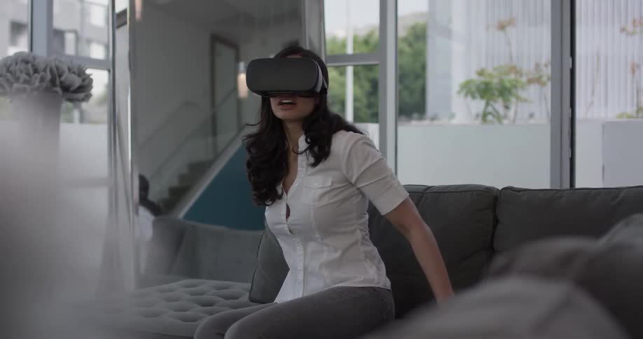 Woman In Apartment Using Electronics