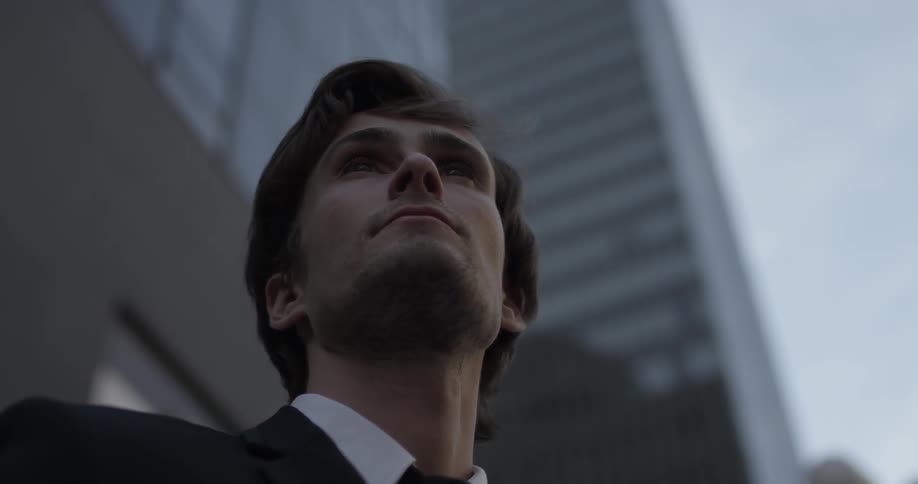 A man is outside and looking around