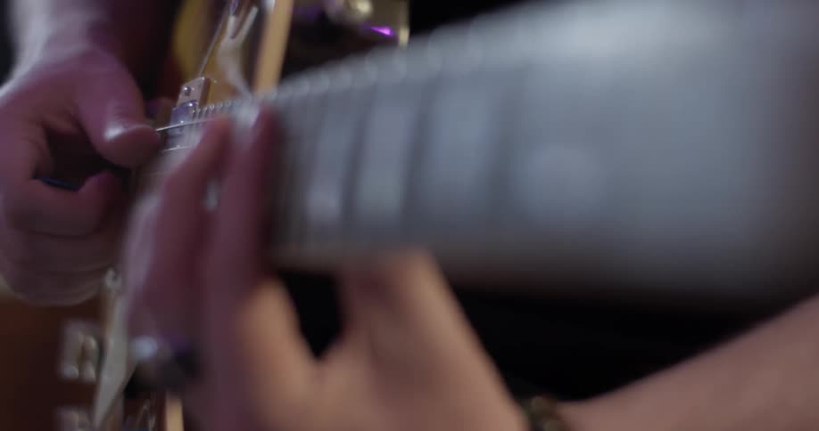 A man playing an electric guitar