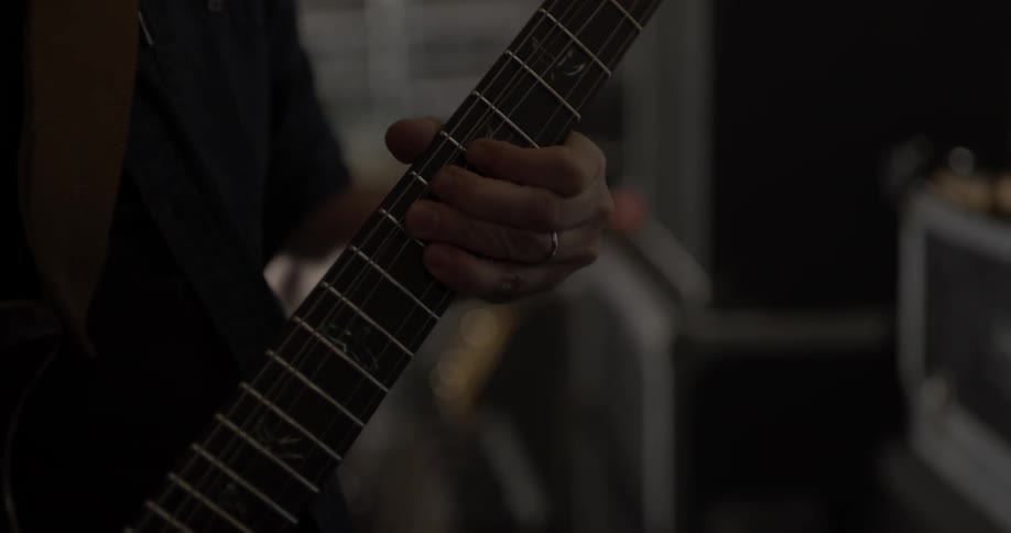 Man plays guitar