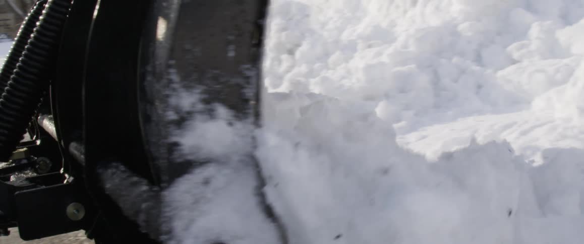 A snow plow moving snow