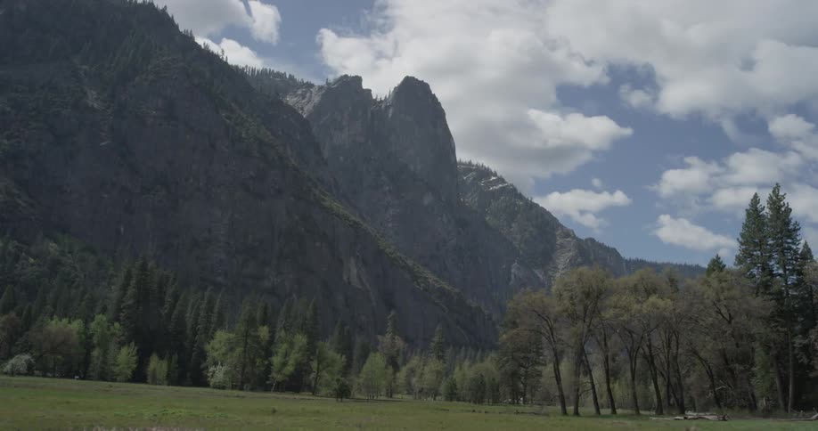 Park with mountains and clouds in the background