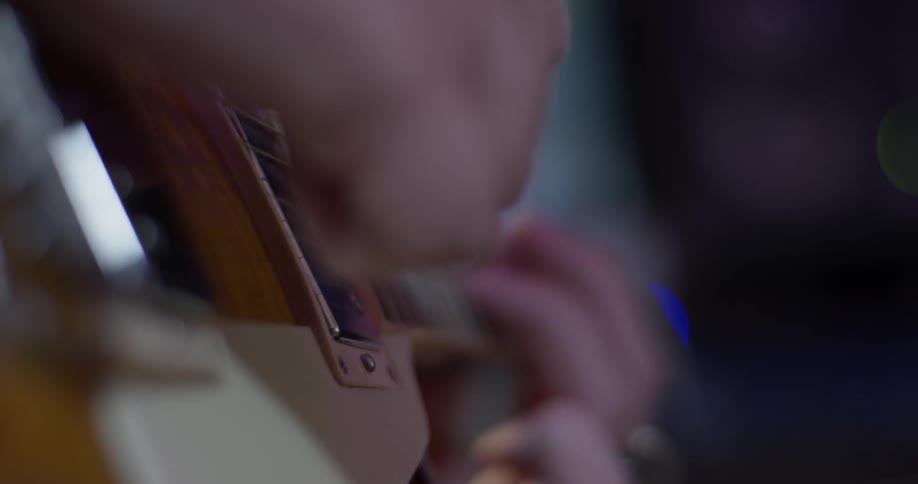 A person playing an electric guitar