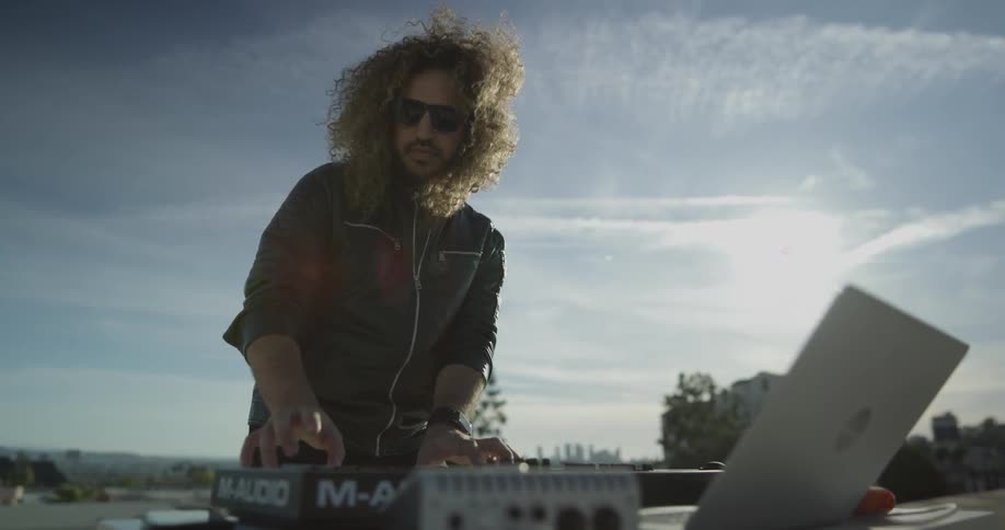 A man is playing music outside