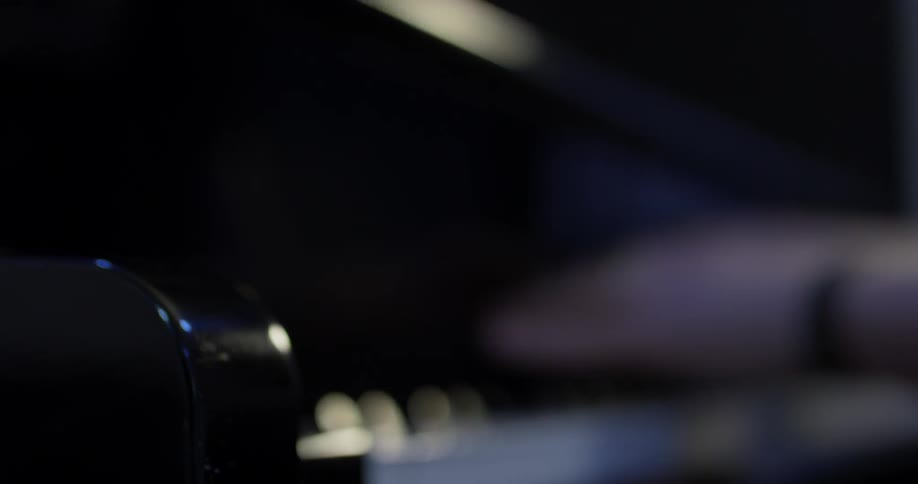 Man playing a piano in a studio