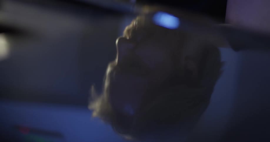 Man bobs his head while playing the piano