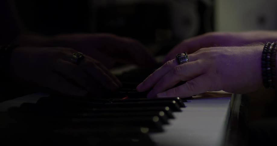 Hands playing piano