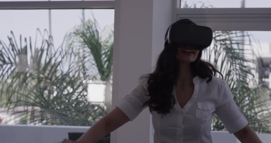 Woman In Apartment Using Electronics