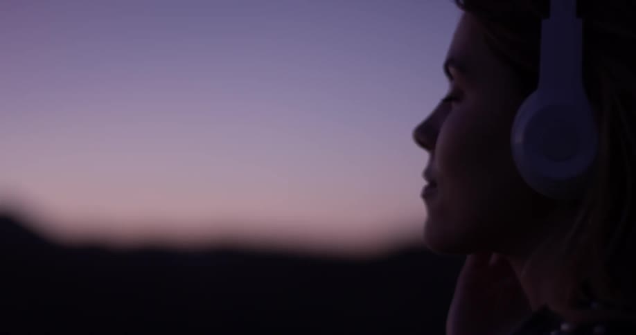 Woman Looking At Scenic View At Sunset