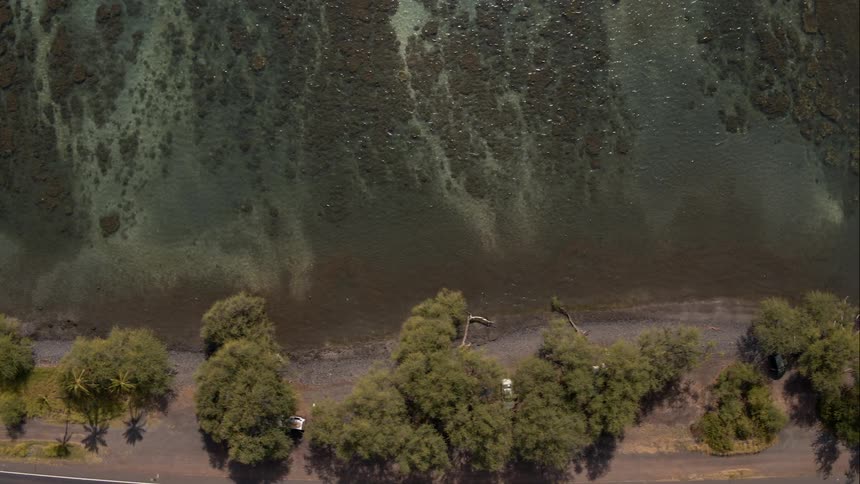 Water flows next to a road