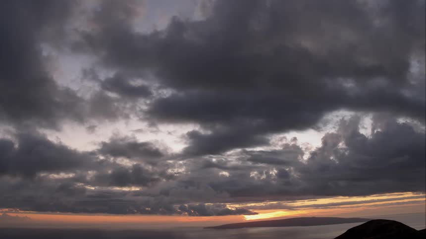The sun sets over an ocean