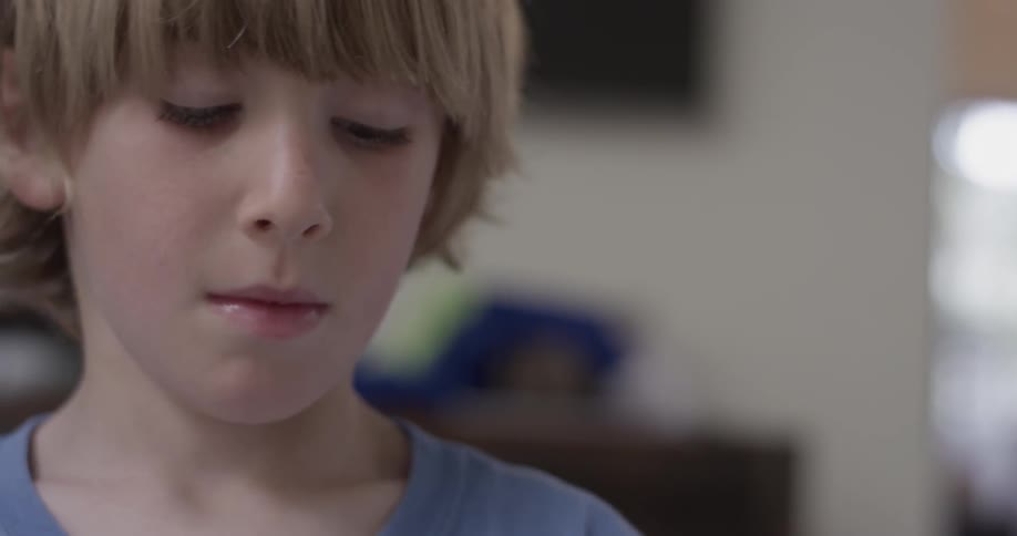 A young boy looks around inside