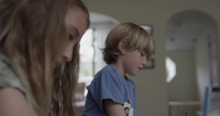 Two children are working beside each other