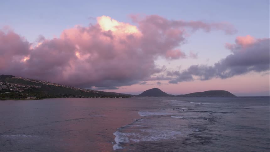 Clouds sit far beyond the lone beach