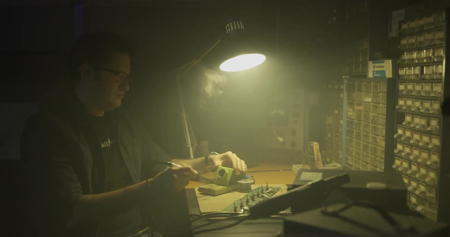 A man soldering things in a workshop
