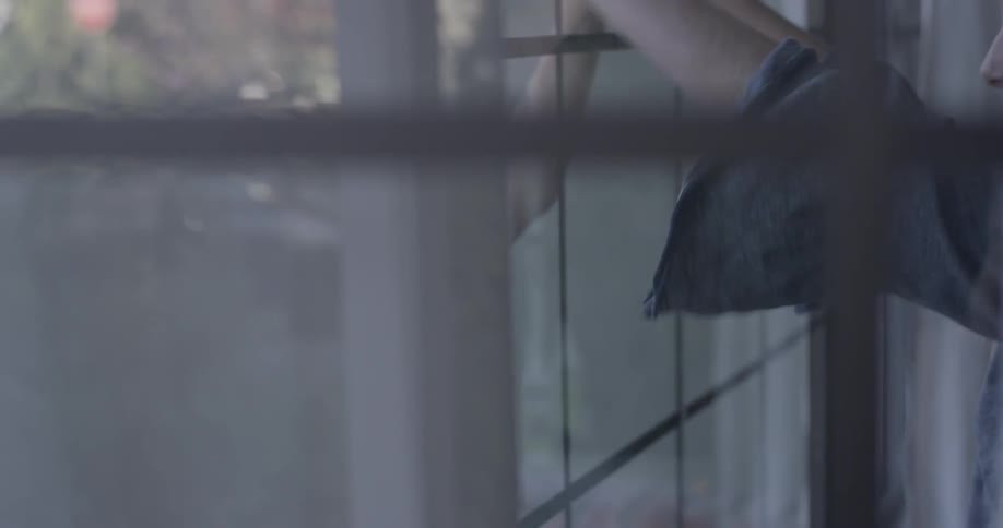 Two kids playing games through a pane of glass