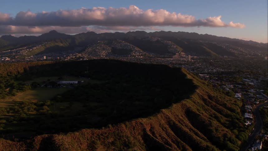Aerial view of mountainside with small city