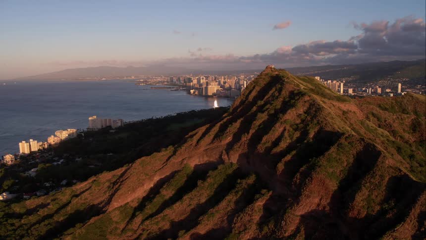 Aerial of a mountain overlooking a city