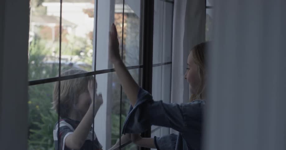 Kids Playing At A Window