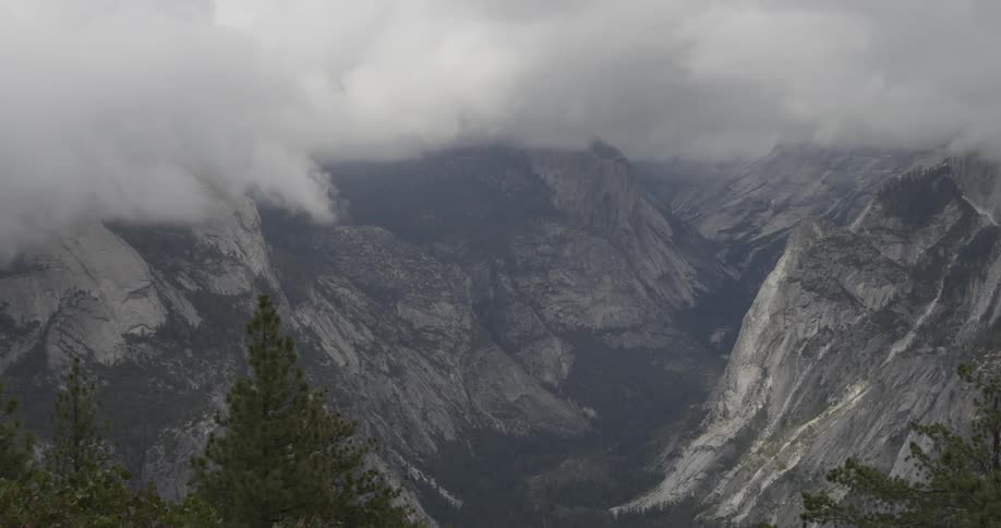 Aerial shot of clouds over a ravine