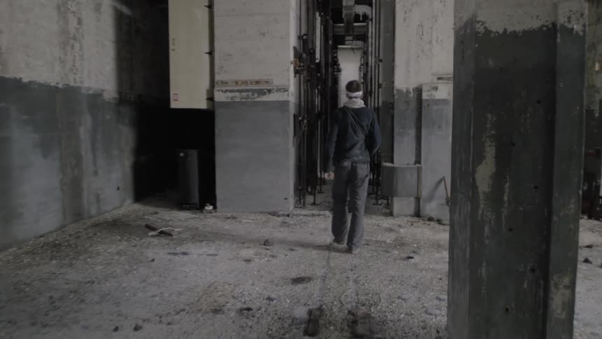 A man walks through a building