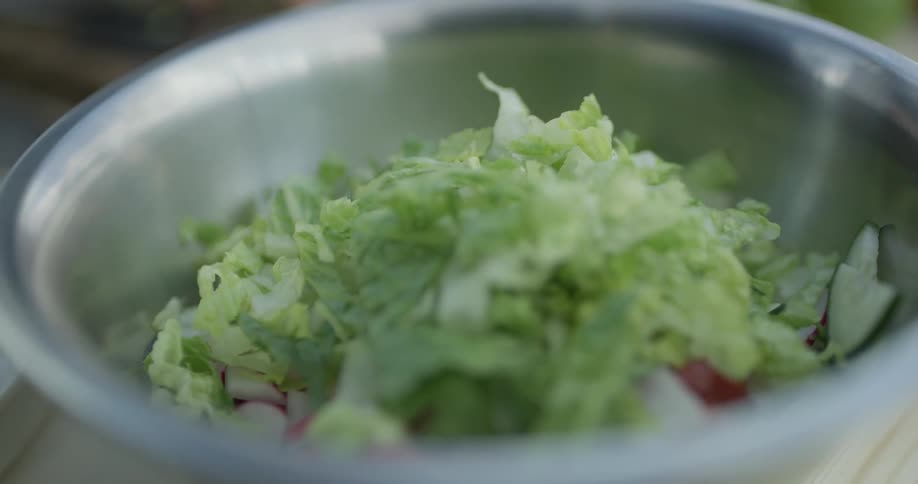 A bowl is filled with chopped vegetables