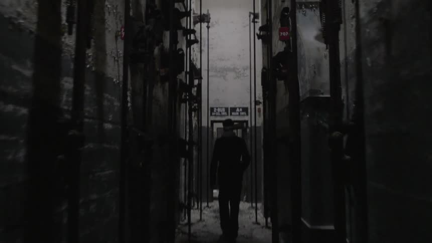 A man is walking in a building