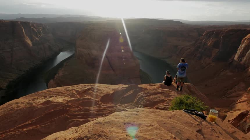 People sitting on a cliff edge