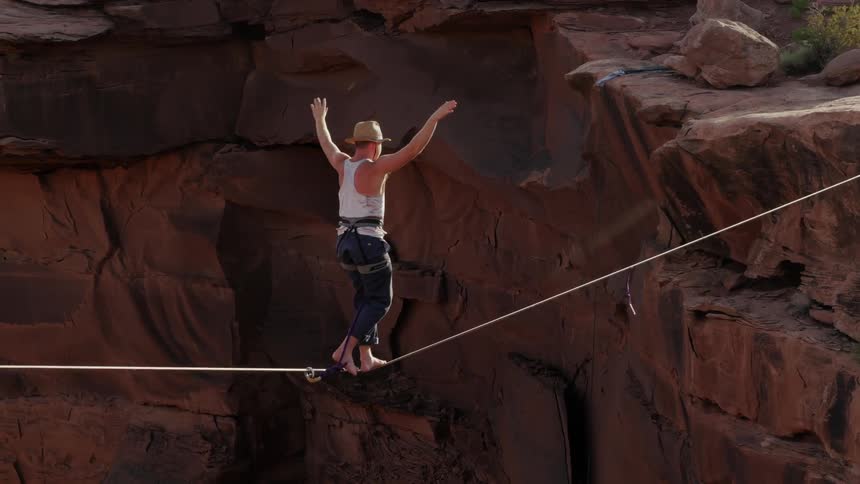 A person walking a tightrope