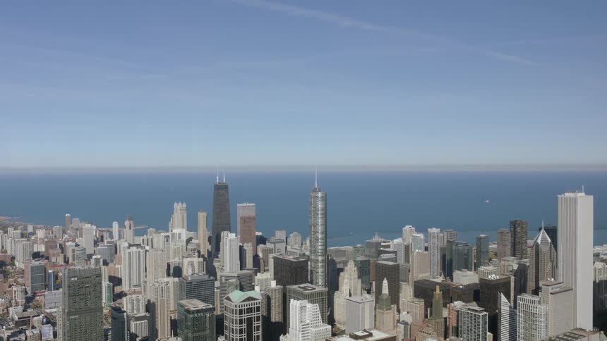 City buildings standing in front of an ocean