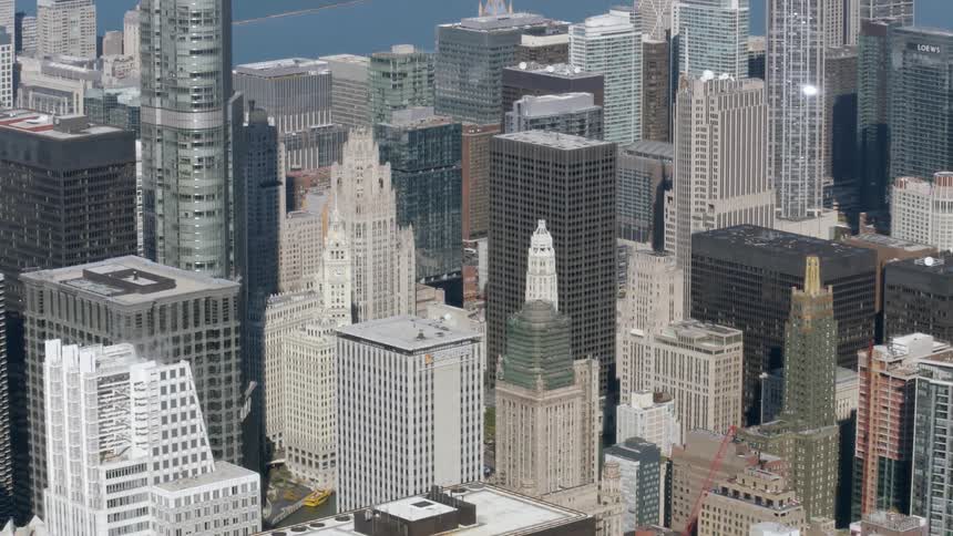 Aerial view of the tops of many buildings in a city