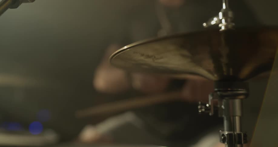 A man is playing the drums