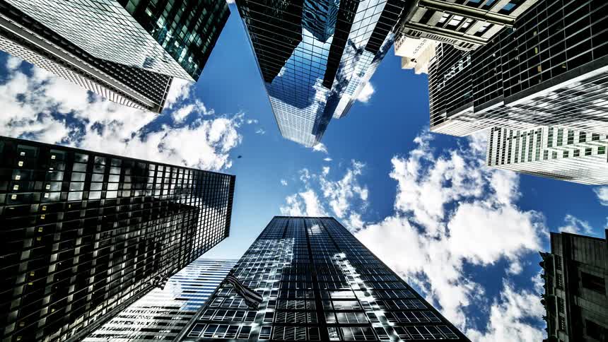 Clouds pass over a cluster of skyscrapers