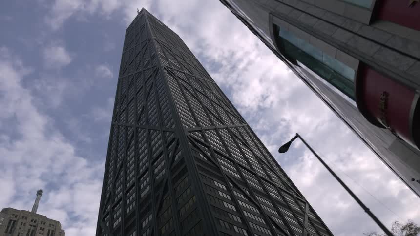 A view of tall skyscrapers in a city is displayed
