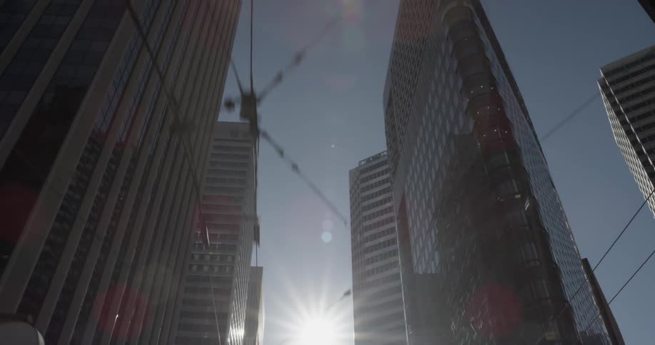 City skyscrapers loom overhead