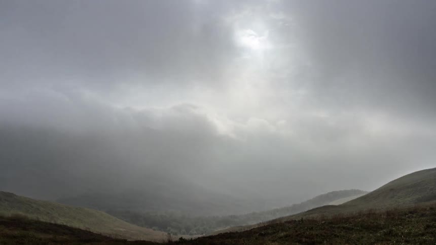 Clouds pass over valley during the day